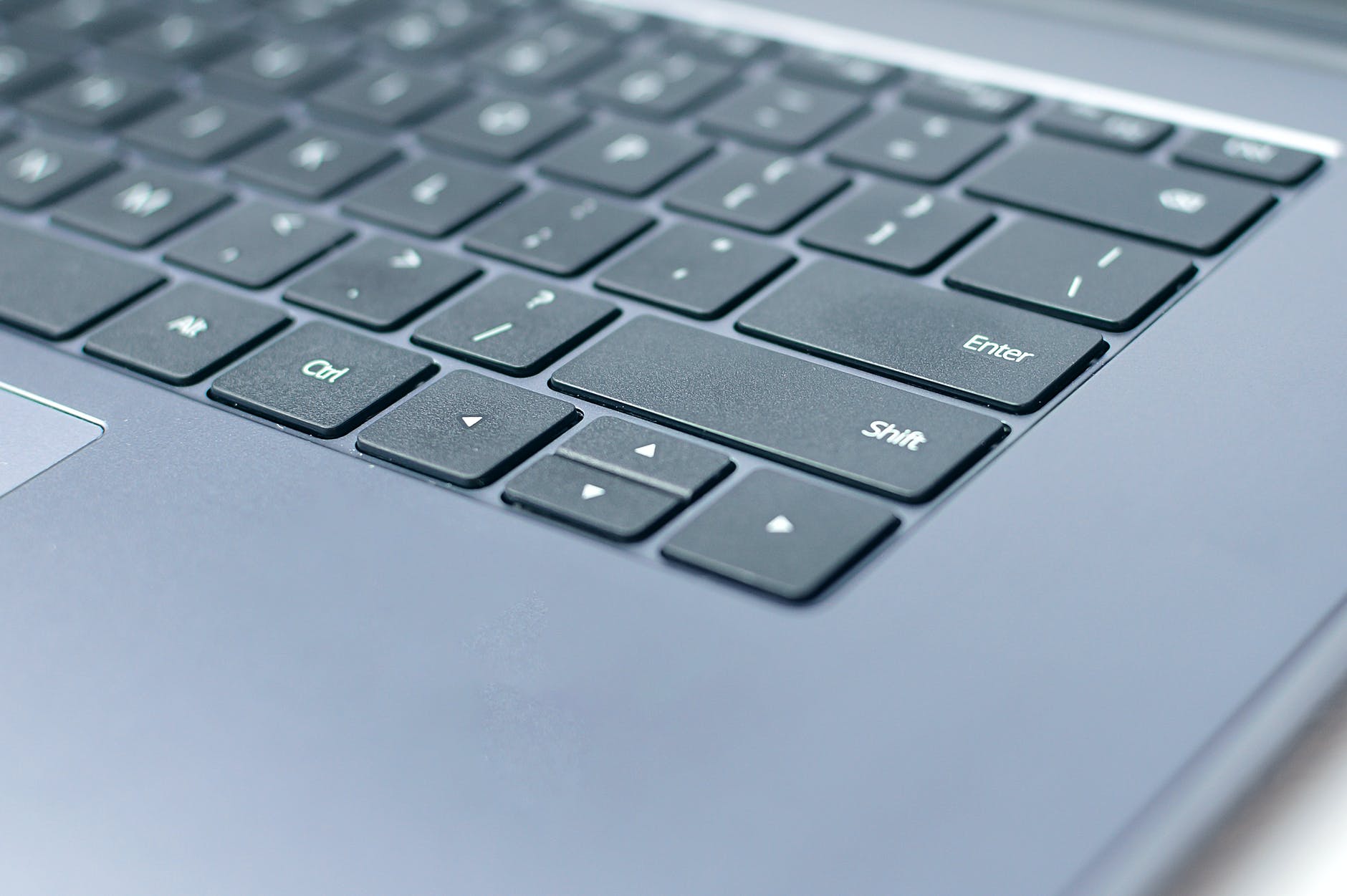 modern laptop keyboard with symbols on keys